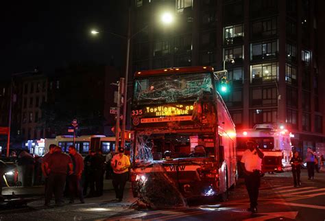 Dozens injured after a double-decker bus and a city bus collide in Manhattan, officials say